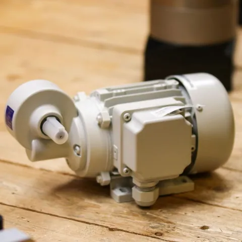 Industrial electric motor on a workshop surface